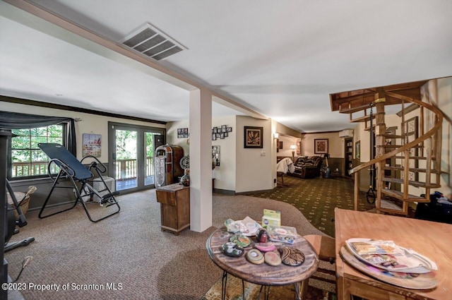 carpeted living room with crown molding