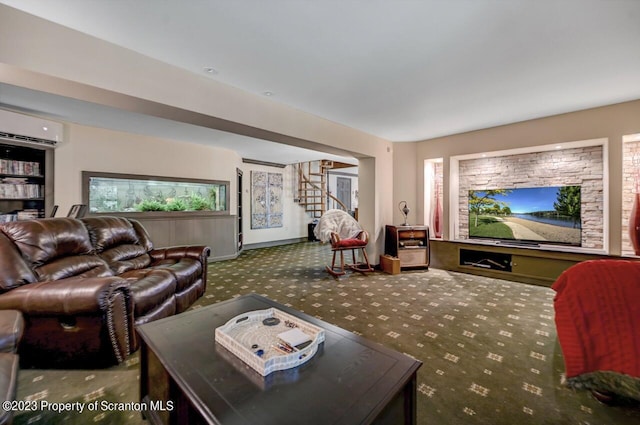 living room with a wall mounted air conditioner and dark colored carpet