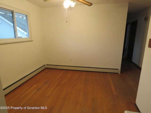 unfurnished room with hardwood / wood-style flooring, a baseboard heating unit, and ceiling fan