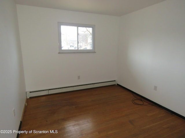 unfurnished room featuring a baseboard radiator and dark wood-type flooring