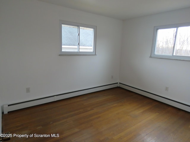 unfurnished room featuring dark hardwood / wood-style flooring