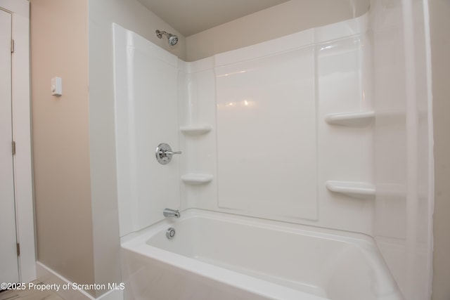 bathroom with shower / tub combination