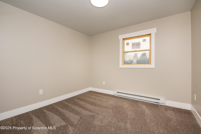 empty room featuring baseboard heating and carpet flooring