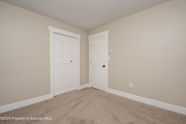 unfurnished bedroom featuring carpet