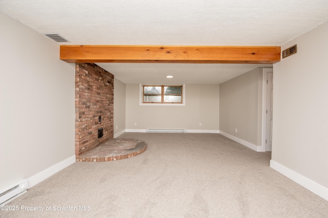 unfurnished living room featuring a brick fireplace, carpet floors, a textured ceiling, and a baseboard radiator