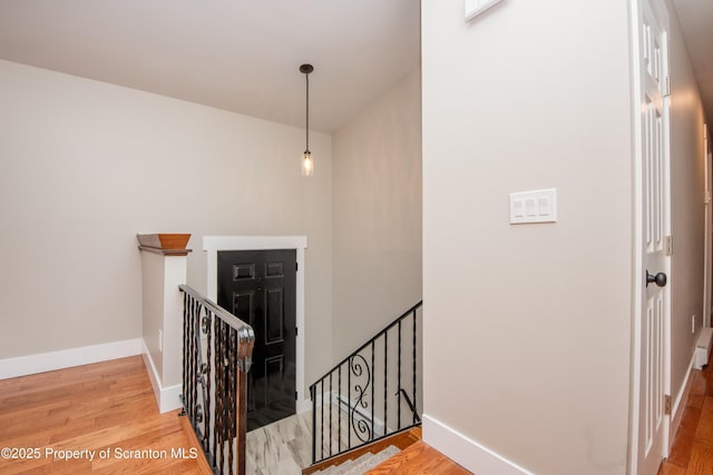 staircase featuring hardwood / wood-style flooring