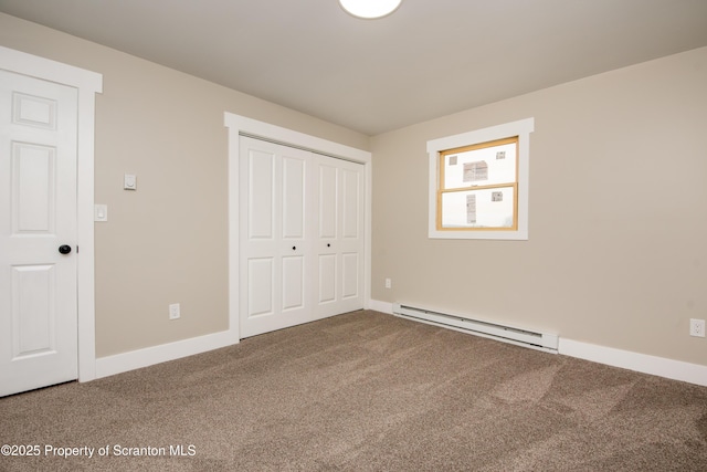 unfurnished bedroom with a baseboard radiator, a closet, and carpet floors