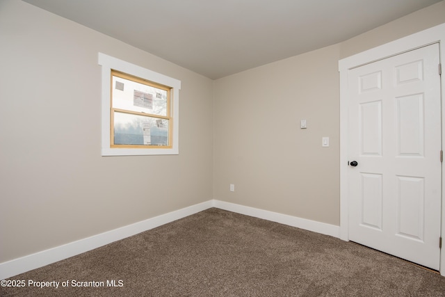 unfurnished room with carpet flooring