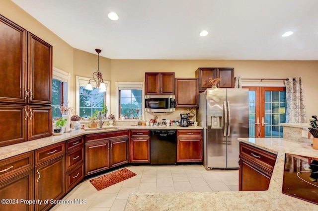 kitchen featuring sink, french doors, stainless steel appliances, pendant lighting, and light tile patterned floors