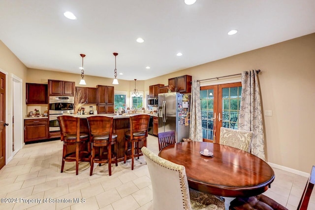 tiled dining room with french doors