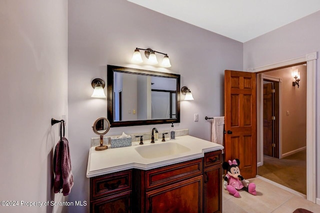 bathroom with tile patterned flooring and vanity