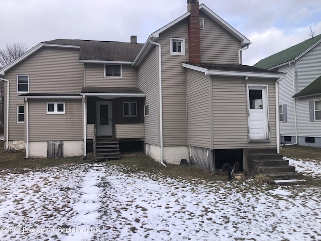 view of snow covered house