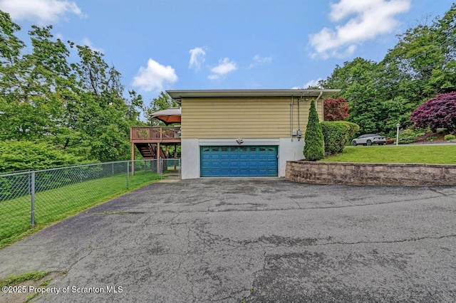 21 Leslie Dr, Scranton, PA 18505 - view of side of home with asphalt driveway, a deck, an attached garage, and stairway