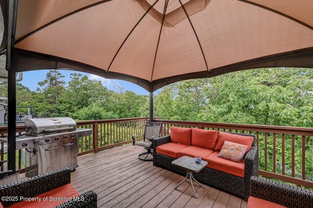 21 Leslie Dr, Scranton, PA 18505 - wooden terrace with outdoor lounge area, area for grilling, and view of wooded area