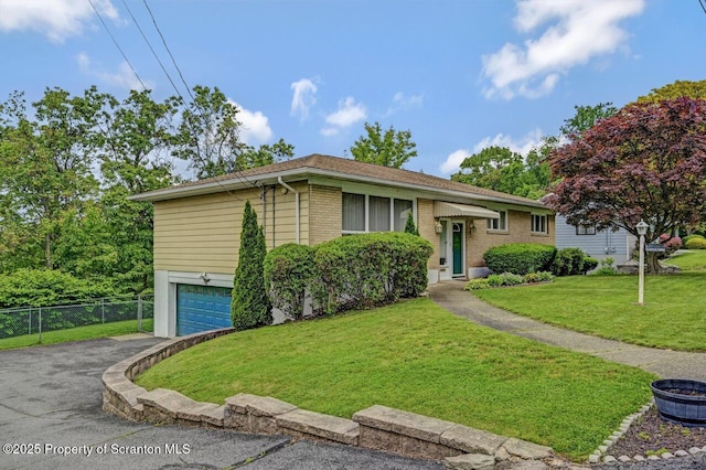 21 Leslie Dr, Scranton, PA 18505 - bi-level home featuring an attached garage, driveway, and brick siding