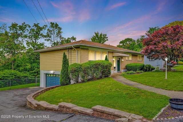 21 Leslie Dr, Scranton, PA 18505 - view of front of property with a garage, asphalt driveway, and brick siding
