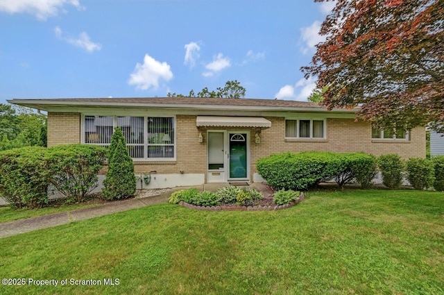 21 Leslie Dr, Scranton, PA 18505 - view of front of house with brick siding and a front lawn