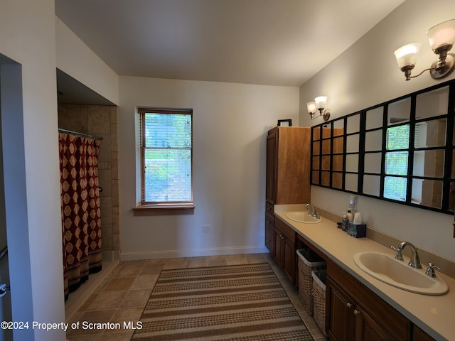 bathroom featuring a shower with curtain and vanity