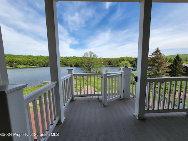 wooden terrace with a water view