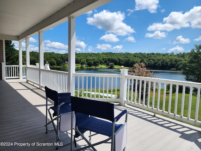 wooden deck with a water view