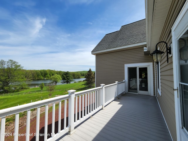 wooden deck featuring a water view