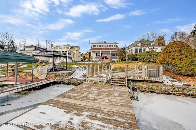 dock area featuring a wooden deck and a gazebo