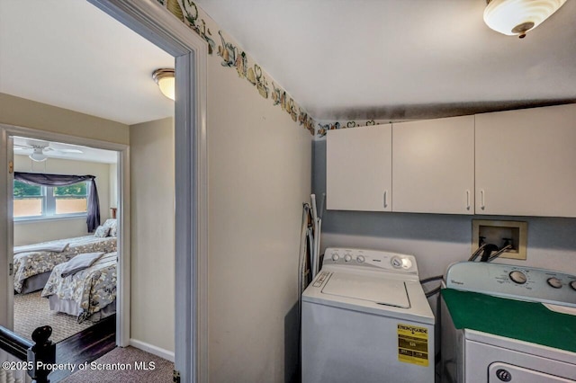 laundry room featuring carpet flooring, ceiling fan, cabinets, and independent washer and dryer