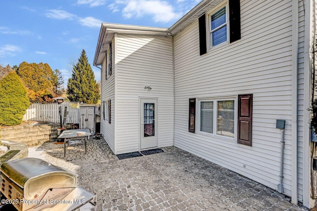 rear view of house featuring a patio