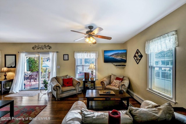 living room featuring ceiling fan, baseboard heating, and hardwood / wood-style floors