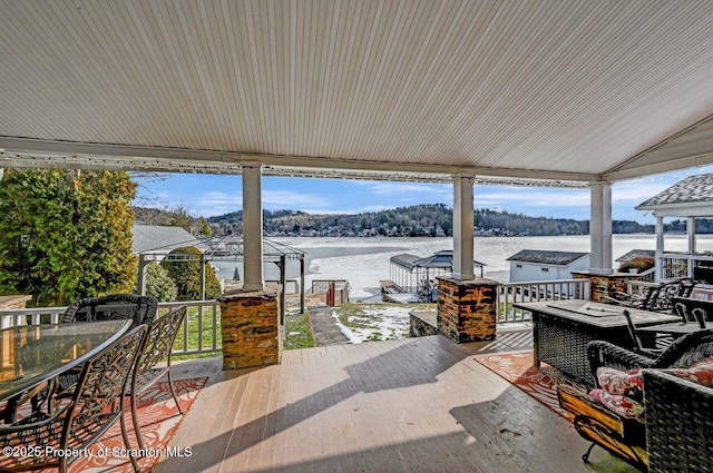 view of patio with a water view