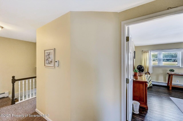 hall with dark hardwood / wood-style flooring and a baseboard radiator