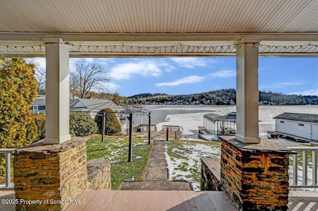 view of patio featuring a water view and a gazebo