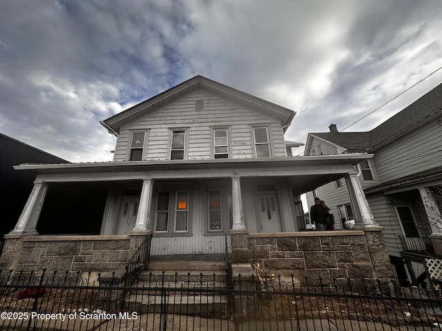 335-337 S Main Ave, Scranton, PA 18504 - view of front of property featuring covered porch and a fenced front yard
