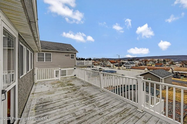 wooden deck with a residential view