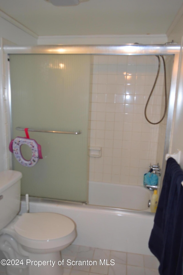 bathroom with tile patterned flooring, enclosed tub / shower combo, and toilet