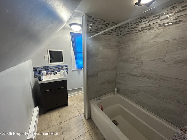 bathroom featuring a baseboard radiator, decorative backsplash, tile patterned floors, vanity, and tiled shower / bath