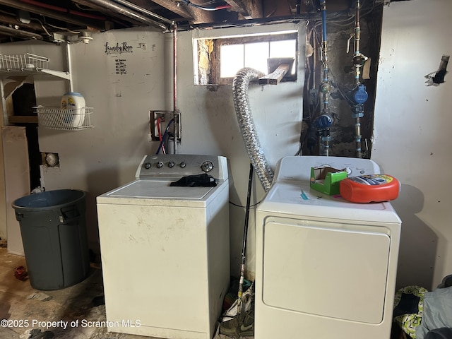 clothes washing area featuring independent washer and dryer