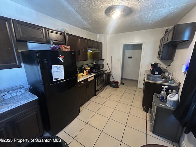 kitchen featuring black appliances, a textured ceiling, light tile patterned floors, sink, and dark brown cabinetry