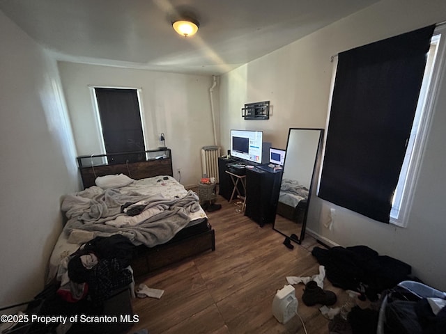 bedroom featuring hardwood / wood-style flooring