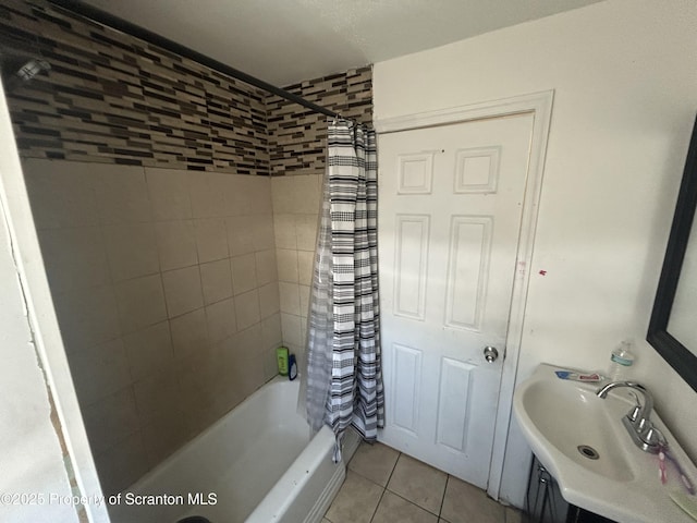 bathroom with sink, shower / tub combo, and tile patterned flooring