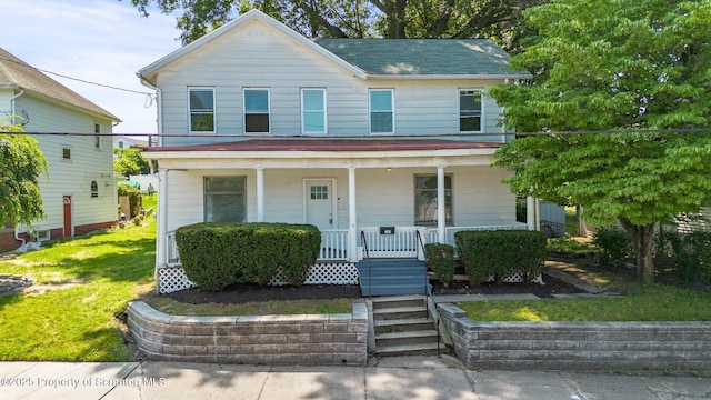 1303 Main St, Pittston, PA 18640 - view of front facade with covered porch and a front yard