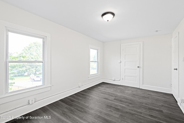 1303 Main St, Pittston, PA 18640 - unfurnished bedroom with dark wood-type flooring and baseboards