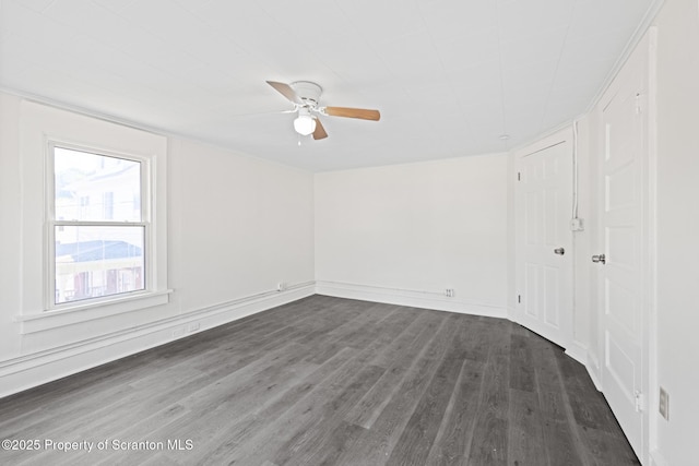 1303 Main St, Pittston, PA 18640 - empty room featuring a ceiling fan and dark wood-style flooring