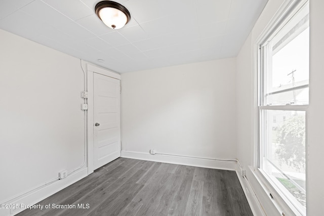 1303 Main St, Pittston, PA 18640 - unfurnished room featuring healthy amount of natural light and dark wood-style flooring
