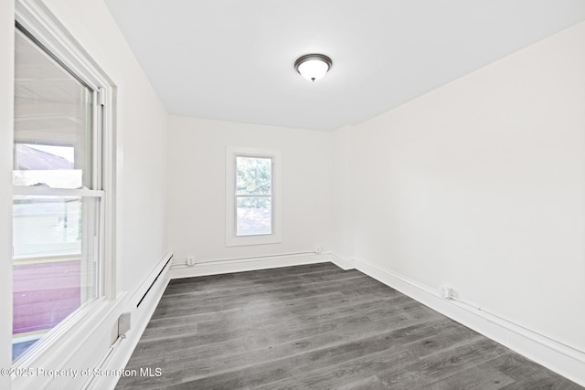 1303 Main St, Pittston, PA 18640 - empty room with dark wood-style floors and baseboards