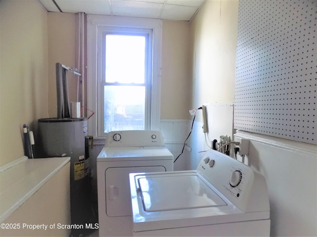 laundry area featuring separate washer and dryer and electric water heater