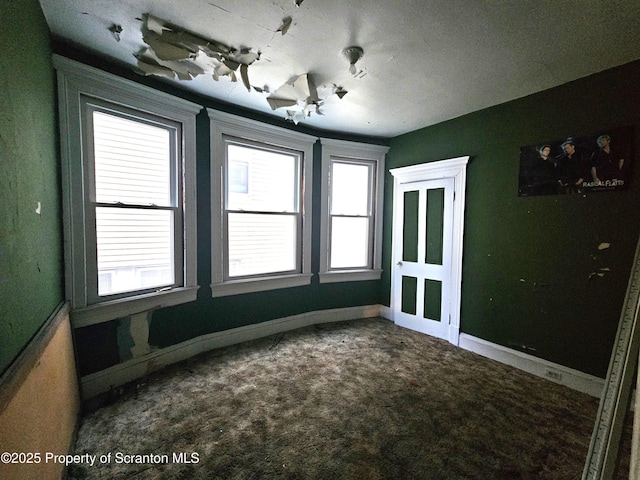 empty room featuring carpet flooring