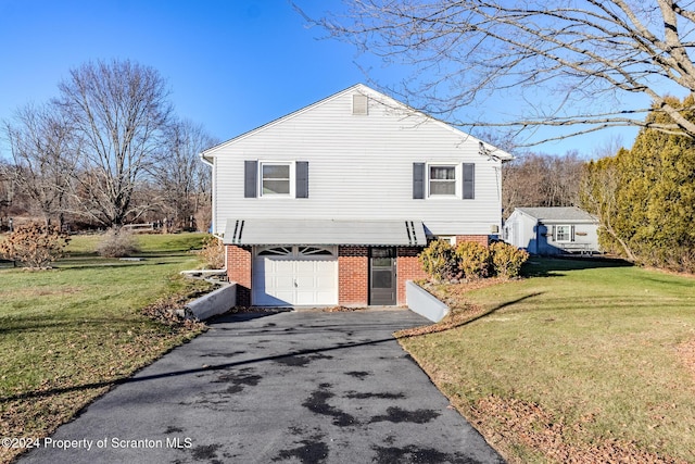 view of side of home with a garage and a yard