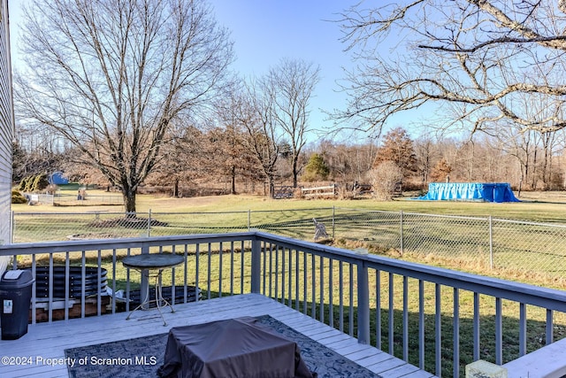 deck with a yard and grilling area