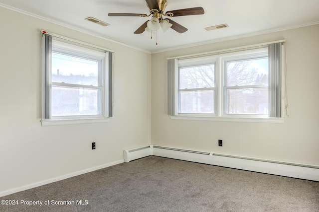 carpeted empty room featuring crown molding, ceiling fan, and a baseboard heating unit